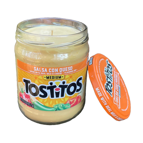 a jar of tostiros sits next to an orange lid